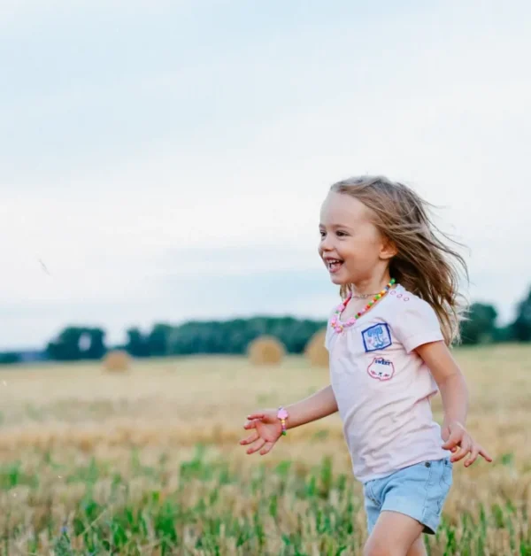 Child Running in Field